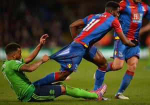 Southampton’s Ryan Bertrand resorts to desperate measures to stop Crystal Palace’s Wilfried Zaha. Palace won 1-0 and are sixth in the table.