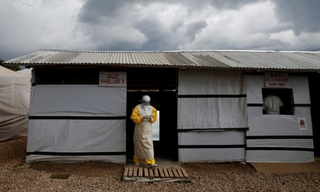 A health worker in protective clothing leaves the dressing room at the Ebola treatment centre in Beni, in the Democratic Republic of the Congo