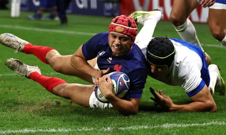 France’s left wing Louis Bielle-Biarrey dives to cross the line to score France’s second try against Italy