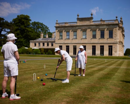 Members of Brodsworth Hall croquet club playing on the lawns.