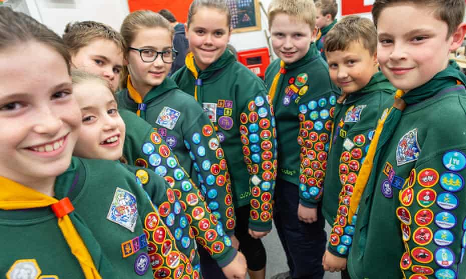 Cub scouts show off their badges. 