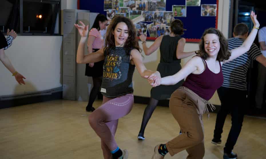 Sarah Marsh, left, learns swing dancing at the Swing Patrol Waterloo with teacher Cat Foley, right.