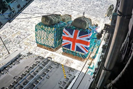Handout photo issued by the UK Ministry of Defence (MoD) dated of humanitarian aid being airdropped over Gaza from a RAF A400M aircraft.