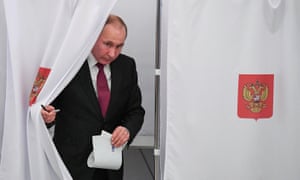 Vladimir Putin at a polling station in Moscow on Sunday