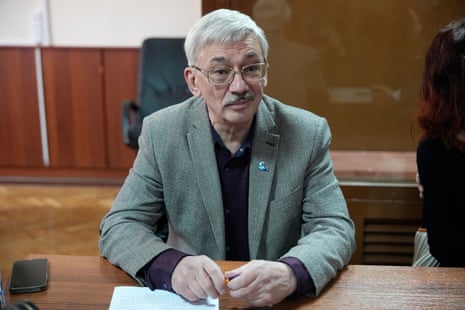Oleg Orlov sits at a courtroom prior to a session in Moscow, Russia.
