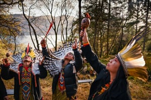 People in traditional dress perform a ritual