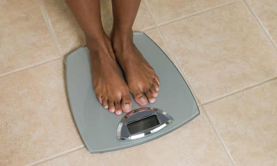 Feet of woman on scales