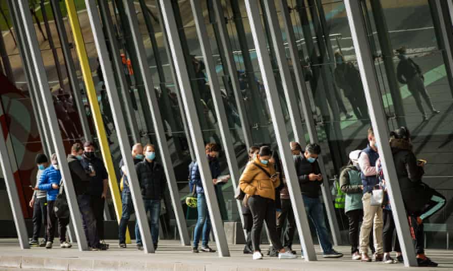 People line up outside the Melbourne Exhibition Centre Covid-19 vaccination centre