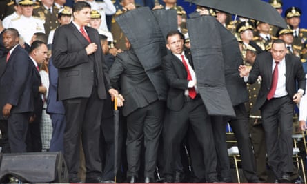 Security personnel surround Venezuela’s president Nicolas Maduro