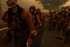 Inmate firefighting crews arrive at a wildfire in the rural community of Moccasin, California.