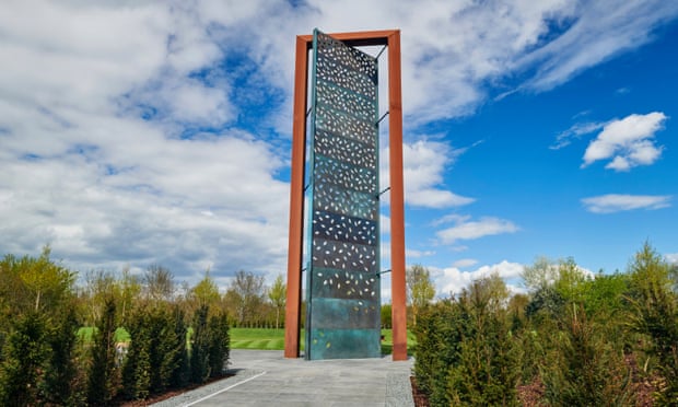 Tall wood and glass sculpture