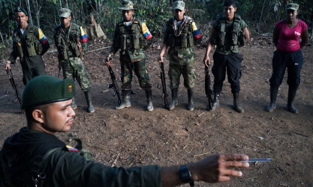 During morning formation, a duty officer for the group points out the exact route the guerrillas will take if attacked by the army. Photograph: Stephen Ferry for the Guardian