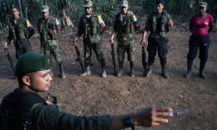 During morning formation, Alias Andrés serves as the duty officer for the group and points out the exact route the guerrillas will take if attacked by the army.
