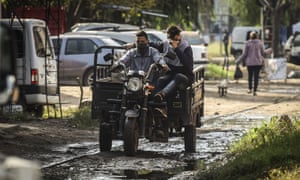 Men ride a motorcycle in Buenos Aires, Argentina.