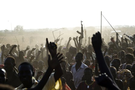 A Sudan People’s Liberation Army (SPLA) soldier waves his AK-47, Malakal, South Sudan