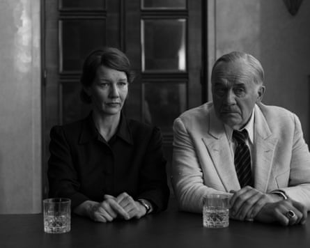 Black-and-white photo of Erika Mann and her father, Thomas Mann, seated at a table, looking serious