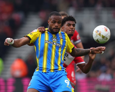 Southampton's Cyle Larin holds off Middlesbrough's Adilson Malanda.