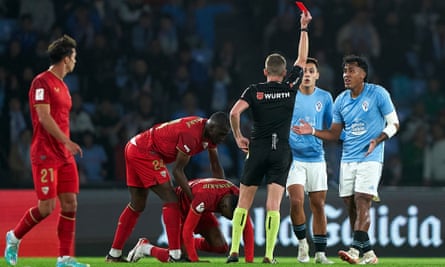 Renato Tapia is shown a red card in the draw with Sevilla.