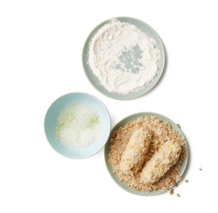 Put the flour on a small plate and the remaining breadcrumbs on a second plate. Whisk the egg whites in their shallow bowl, until frothy, then roll each sausage in turn in the flour, egg white and breadcrumbs to coat, shaking off any excess.