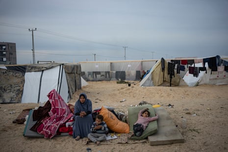 Palestinians displaced by the Israeli ground offensive on the Gaza Strip set up a camp in the al-Mawasi settlement on 7 December.