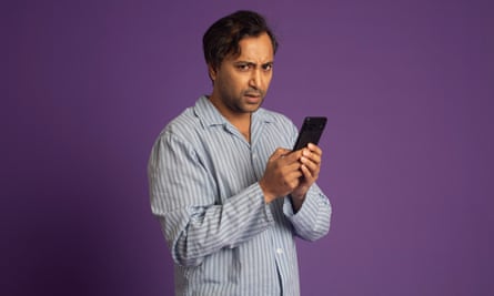 Rhik Samadder in his pyjamas with a phone
