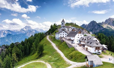 Village on hill with alpine backdrop