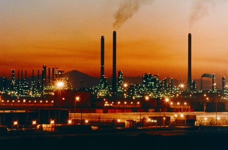A Saudi oil refinery lit up at sunset