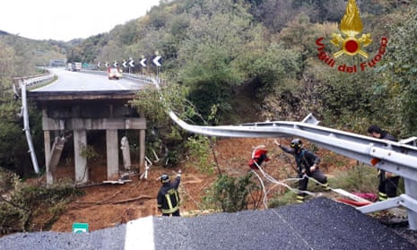 Firefighters at the scene after a stretch of the Turin to Savona A6 highway collapsed after heavy rains