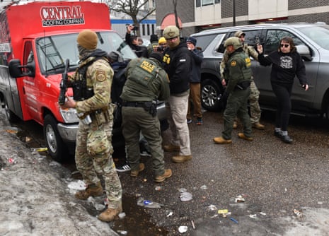 US Border Patrol agents detain a man in Minneapolis, Minnesota, on January 8, 2026. A US Immigration and Customs Enforcement (ICE) agent shot and killed an American woman on the streets of Minneapolis January 7, leading to huge protests and outrage from local leaders who rejected White House claims she was a domestic terrorist. The woman, identified in local media as 37-year-old Renee Nicole Good, was hit at point blank range as she apparently tried to drive away from agents who were crowding around her car, which they said was blocking their way. (Photo by Octavio JONES / AFP via Getty Images)