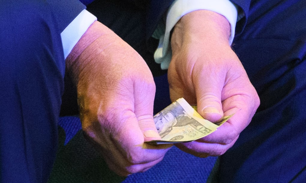 Donald Trump counts banknotes for an offering at the International Church of Las Vegas in Las Vegas in October 2020.