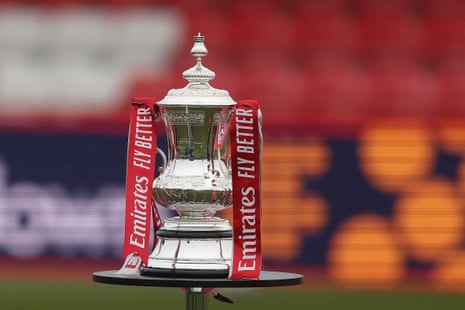 The FA Cup sits pitchside at the Wham Stadium.