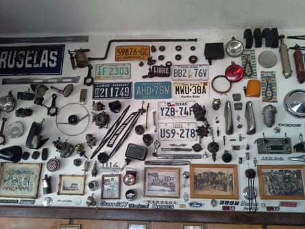old registration plates, gears, hubcaps on the wall at Cafe Olimpo, Buenos Aires, Argentina