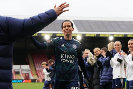 Ashleigh Neville receives a guard of honour from her former Spurs teammates after the match.
