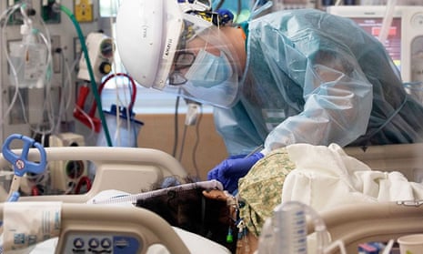 Registered nurse Ashley Cohagen treats a patient inside the intensive care unit at Providence St John’s Health Center in Santa Monica. 