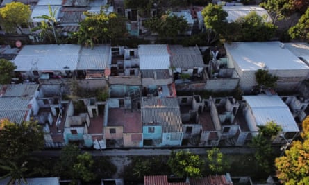 An aerial view of homes abandoned by families who fled after being threatened by gang members, according to authorities, at La Campanera neighborhood.