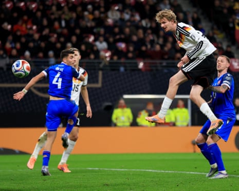 Free as a bird in the box Woltemade of Germany rises to head Germany ahead.