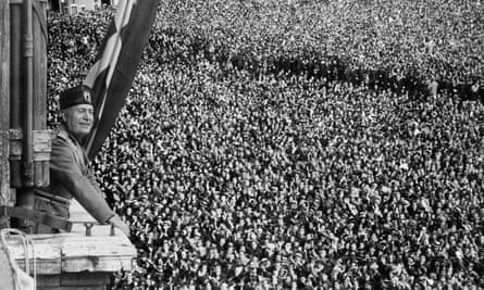 Benito Mussolini addressing crowds from the Palazzo Venezia in Rome, Italy, during the declaration of the Italian empire in May 1936.