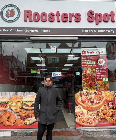 Sheikh Awais stands in front of Roosters Spot, the Clapham High Street chicken shop where he works