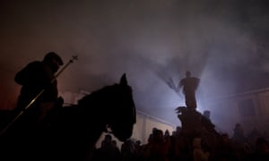 Riding out of the flames through the smoke past the Cascorro statue in San Bartolome de Pinares