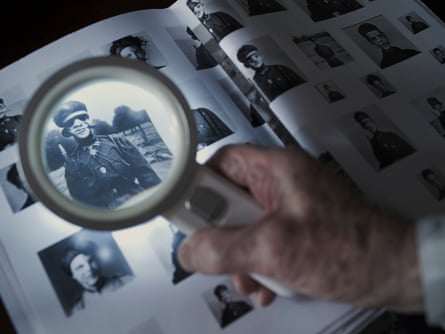 A magnifying glass over a photo album