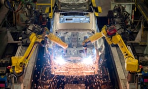 Robots weld vehicle panels at the Nissan plant in Sunderland.