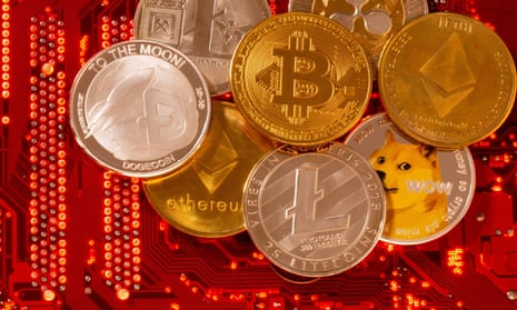 Representations of cryptocurrencies Bitcoin, Ethereum, DogeCoin, Ripple, Litecoin lie on a PC motherboard