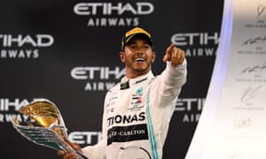 Abu Dhabi winner Lewis Hamilton celebrates on the podium