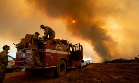 Firefighters battling the Ranch Fire, part of the Mendocino Complex fire, burning along High Valley Road near Clearlake Oaks, California.