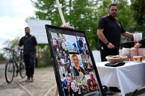 A set of photographs of Damian Soból is seen during his funeral ceremony at the cemetery in Przemysl, Poland, on Saturday.