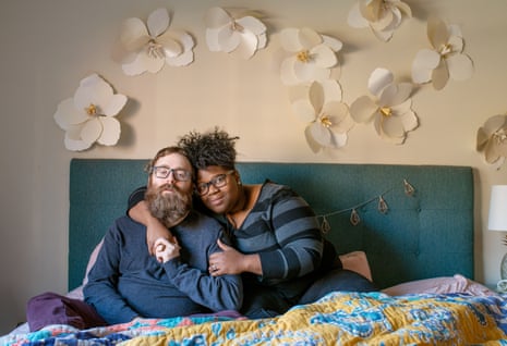Alex, a man on the autism spectrum, photographed in bed with his wife, Santana, 201