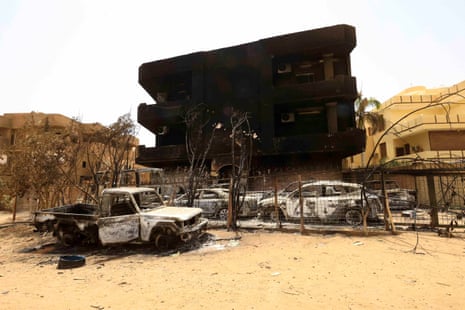 Damaged cars and buildings are seen at the central market in Khartoum North.