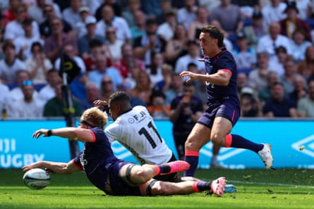 Henry Pollock stretches over the line to ground the ball against Fiji