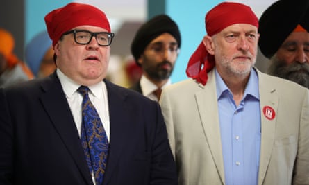 Jeremy Corbyn and Tom Watson take part in a community meeting as the Labour battle bus arrived at the Guru Har Rai Gurdwara Sahib temple in West Bromwich.