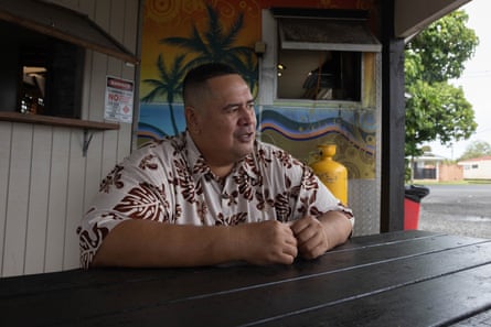 Penrhyn executive director Puna John Vano sitting at a table in Rarotonga